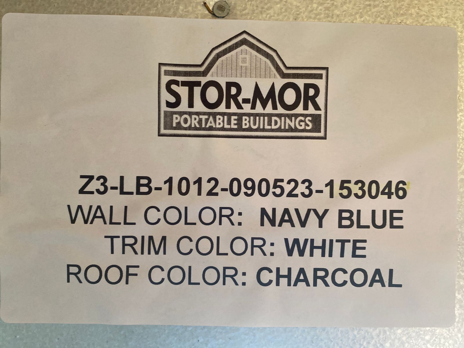 10x12 Stor-Mor Lofted Barn color label: Navy Blue walls, white trim, charcoal roof