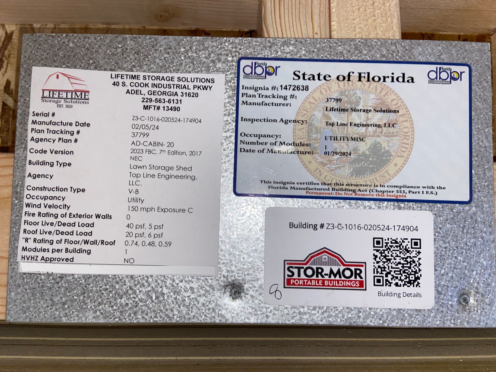 10x16 Navajo White cabin data plate with the State of Florida insignia and QR code
