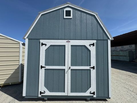 10x16 Stor-Mor Lofted Barn in Belmont Blue with white trim, double shop doors and a gray gambrel roof
