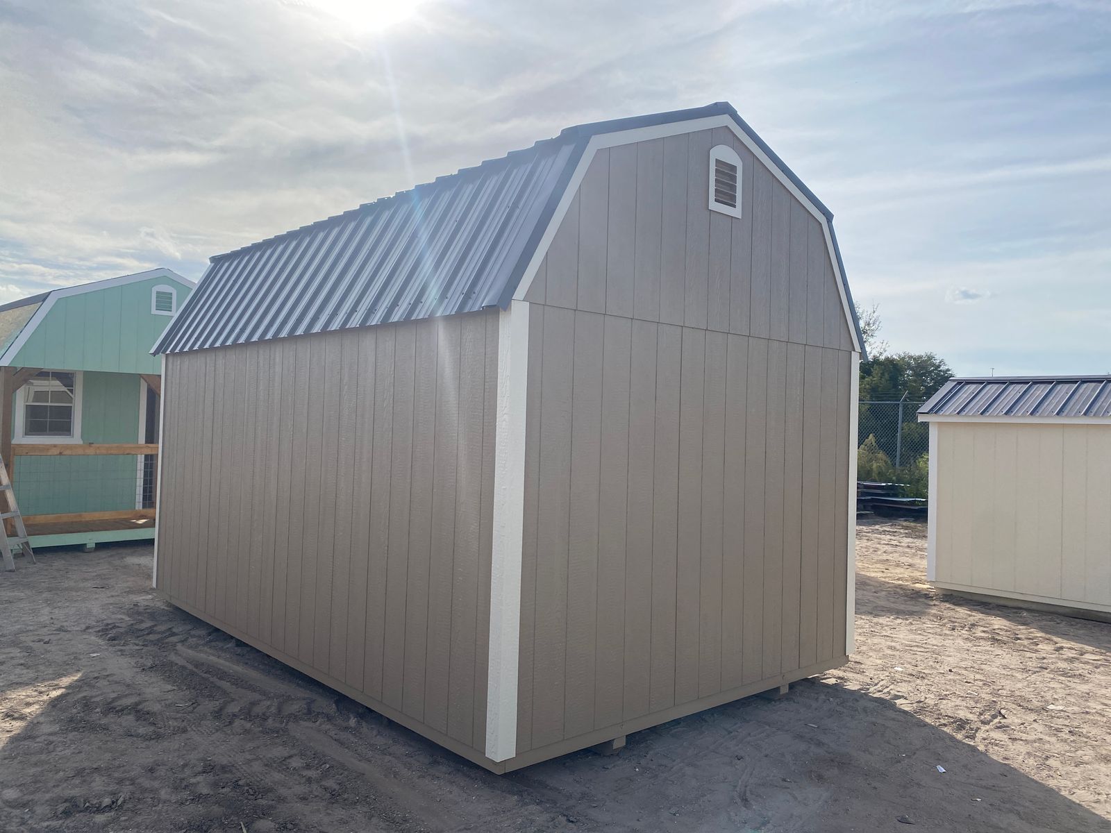 10x16 Buckskin Stor-Mor Lofted Barn rear corner view with gable vent and Burnished Slate metal roof