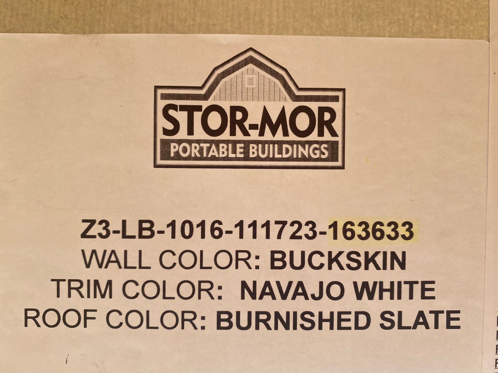10x16 Buckskin Lofted Barn factory color label listing Navajo White trim and Burnished Slate roof