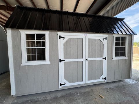 10x16 Stor-Mor Side Lofted Barn in Light Gray with white trim, double shop doors on the long wall and a black roof
