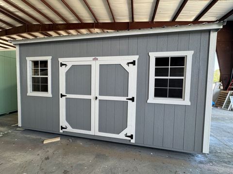 10x16 Stor-Mor Side Utility shed in Cape Cod Gray with white trim, double shop doors on the long wall and a Galvalume roof