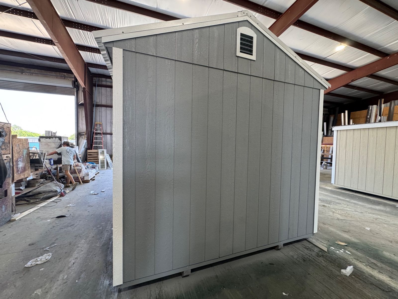 Gable end of the 10x16 Cape Cod Gray Side Utility with a vent and white corner trim