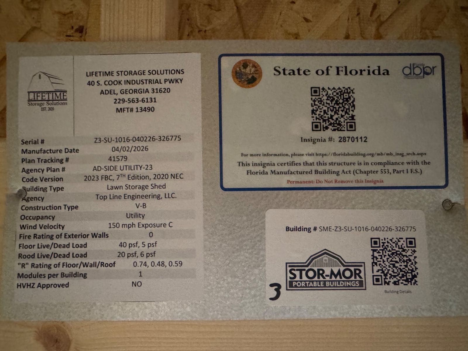 10x16 Cape Cod Gray Side Utility data plate with the State of Florida insignia and QR codes