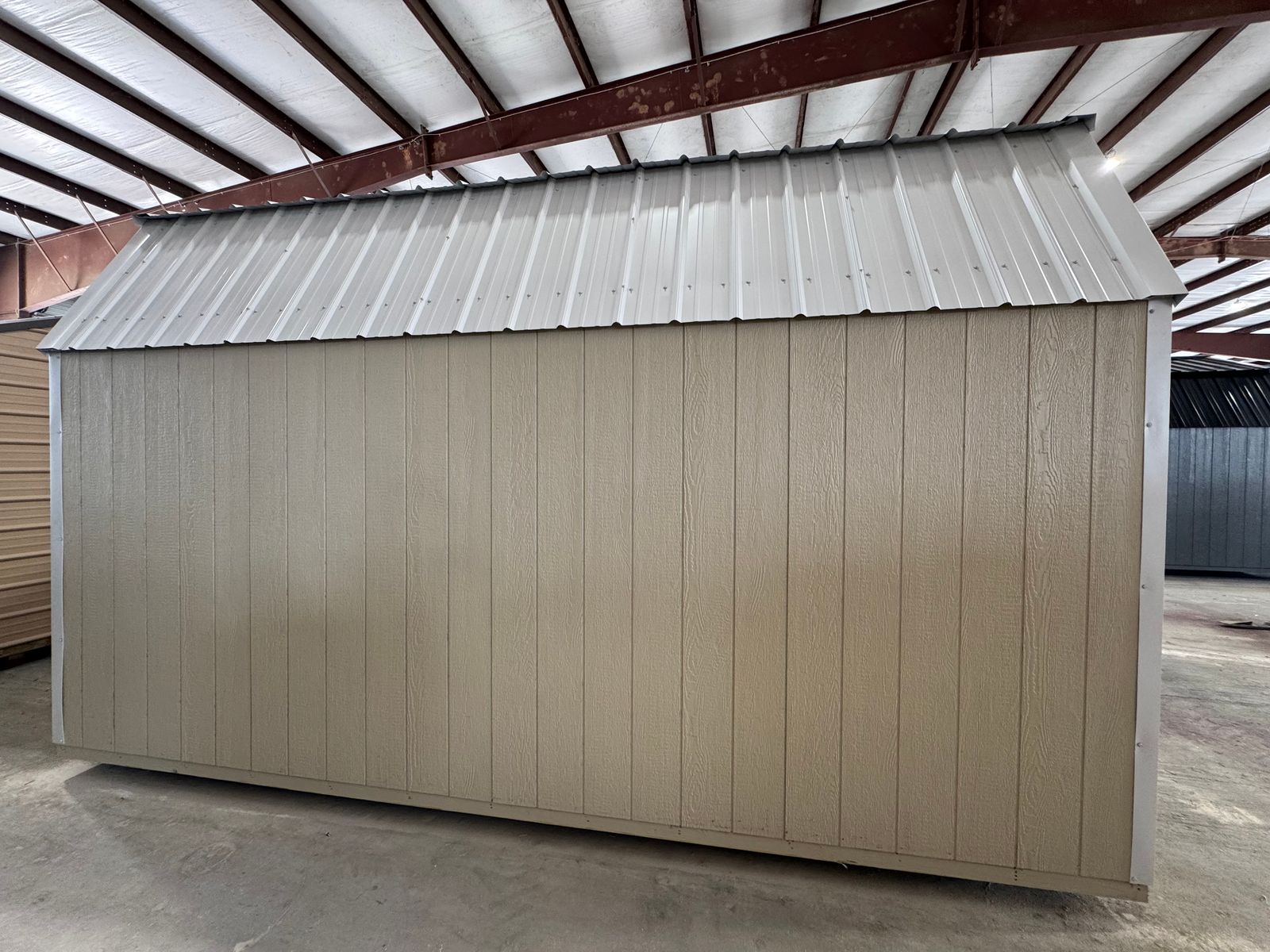 10x16 Stor-Mor Tru-Valu Lofted Barn in New Holland Beige, long side wall under white gambrel roof