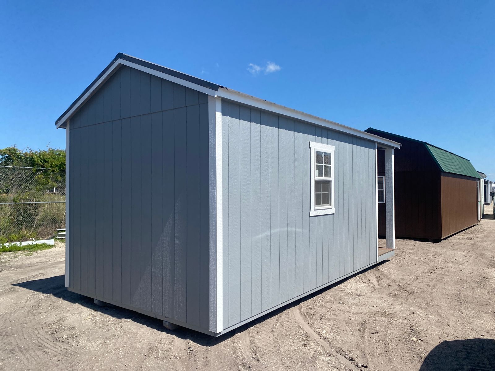 10x20 Cape Cod Gray Stor-Mor cabin, rear corner view with side window and charcoal roof