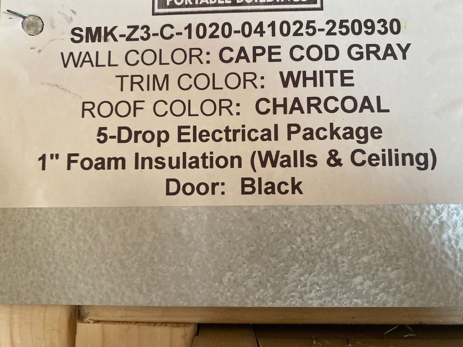 10x20 Cape Cod Gray Stor-Mor cabin build label listing colors, 5-drop electrical and foam insulation