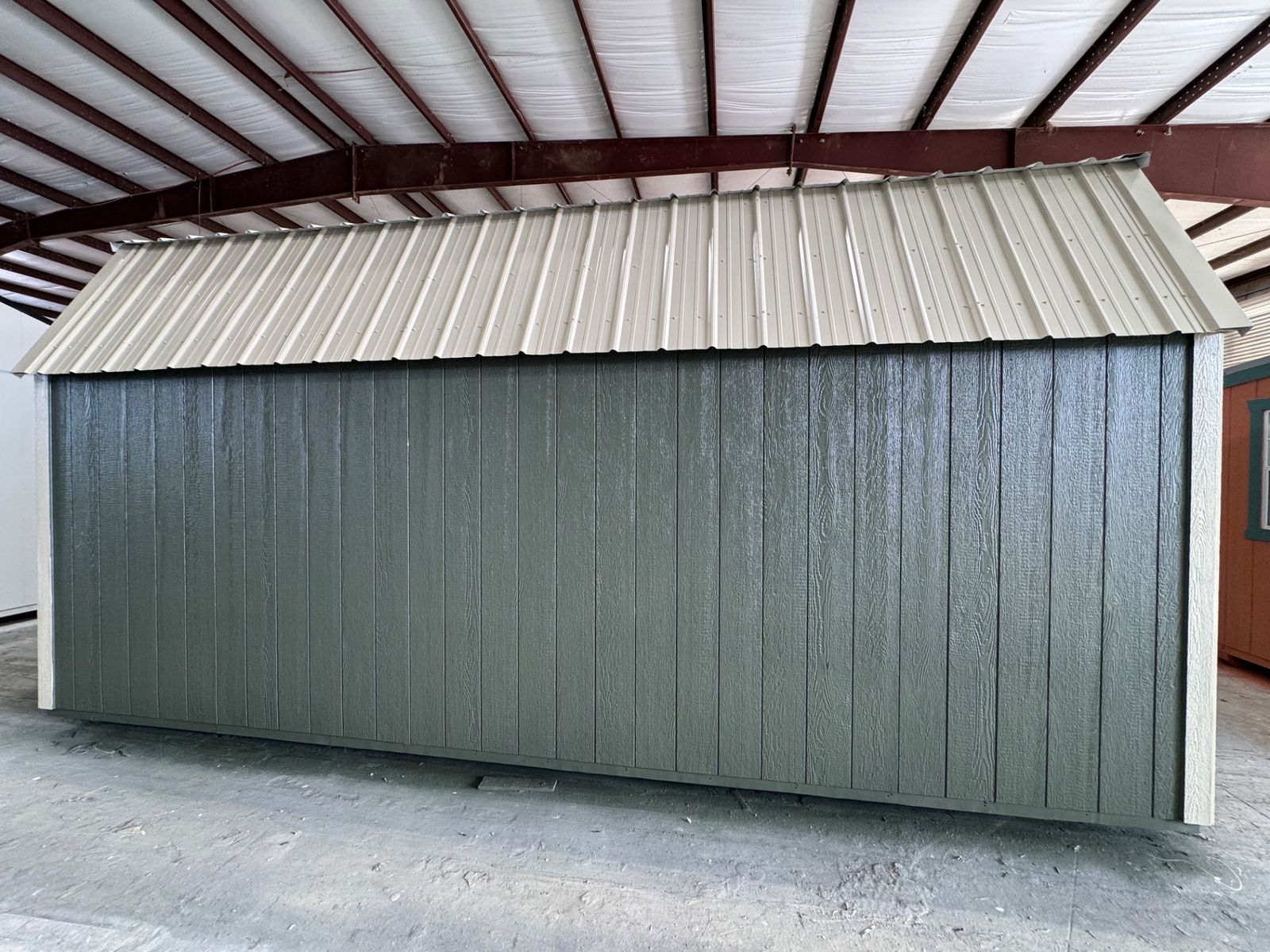 Rear long wall of the 10x20 Avocado Side Lofted Barn under the Light Stone metal roof