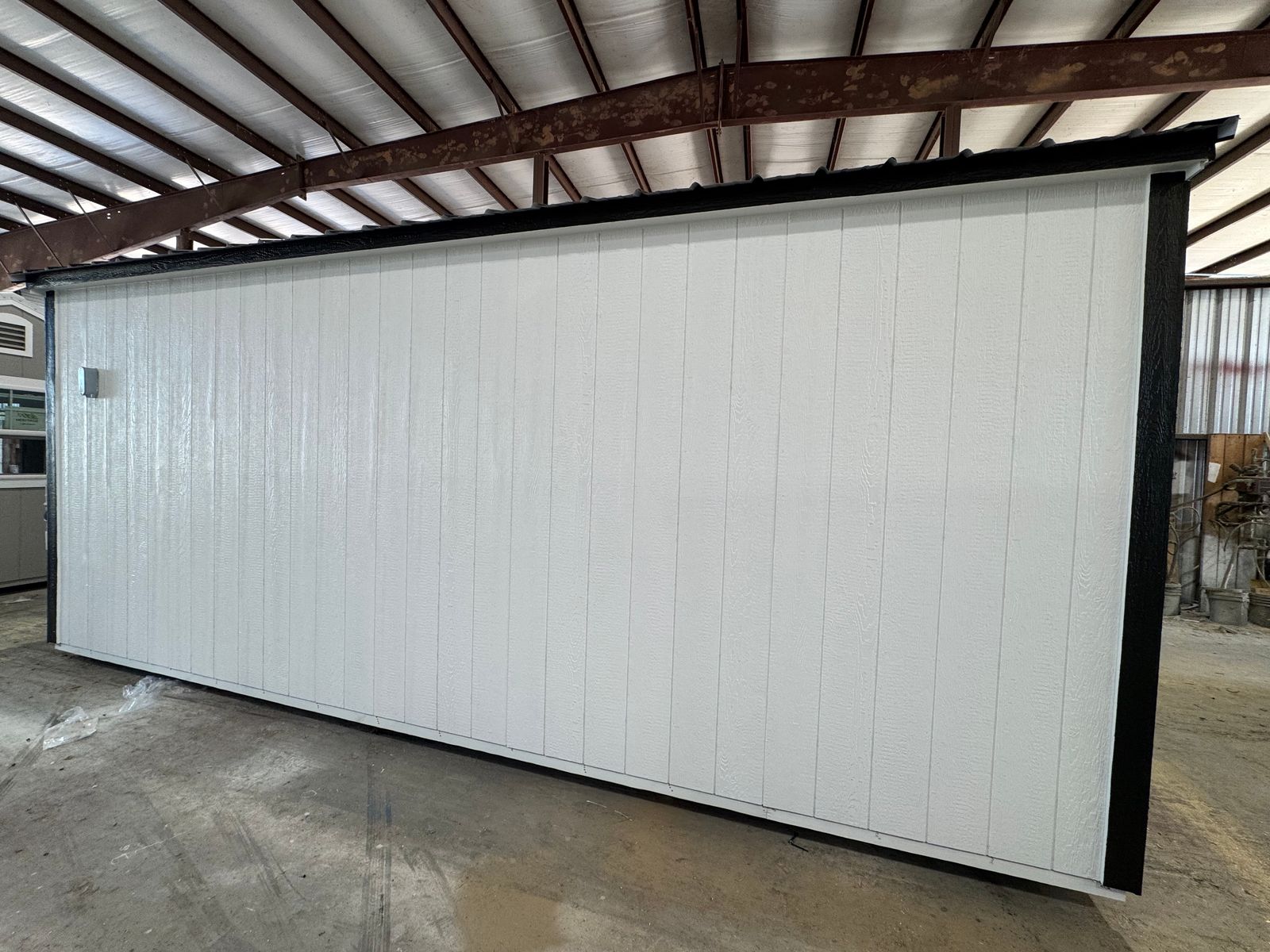 10x20 backyard office in white with black trim, plain long rear wall