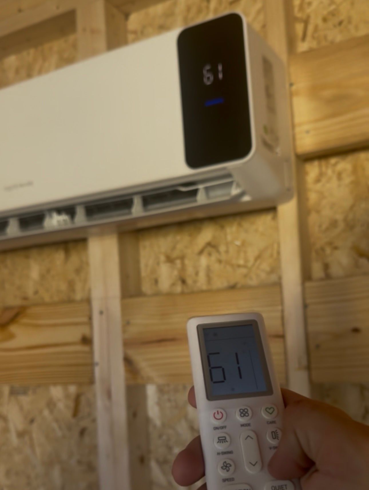 10x20 backyard office 12K BTU mini-split indoor unit with its remote control