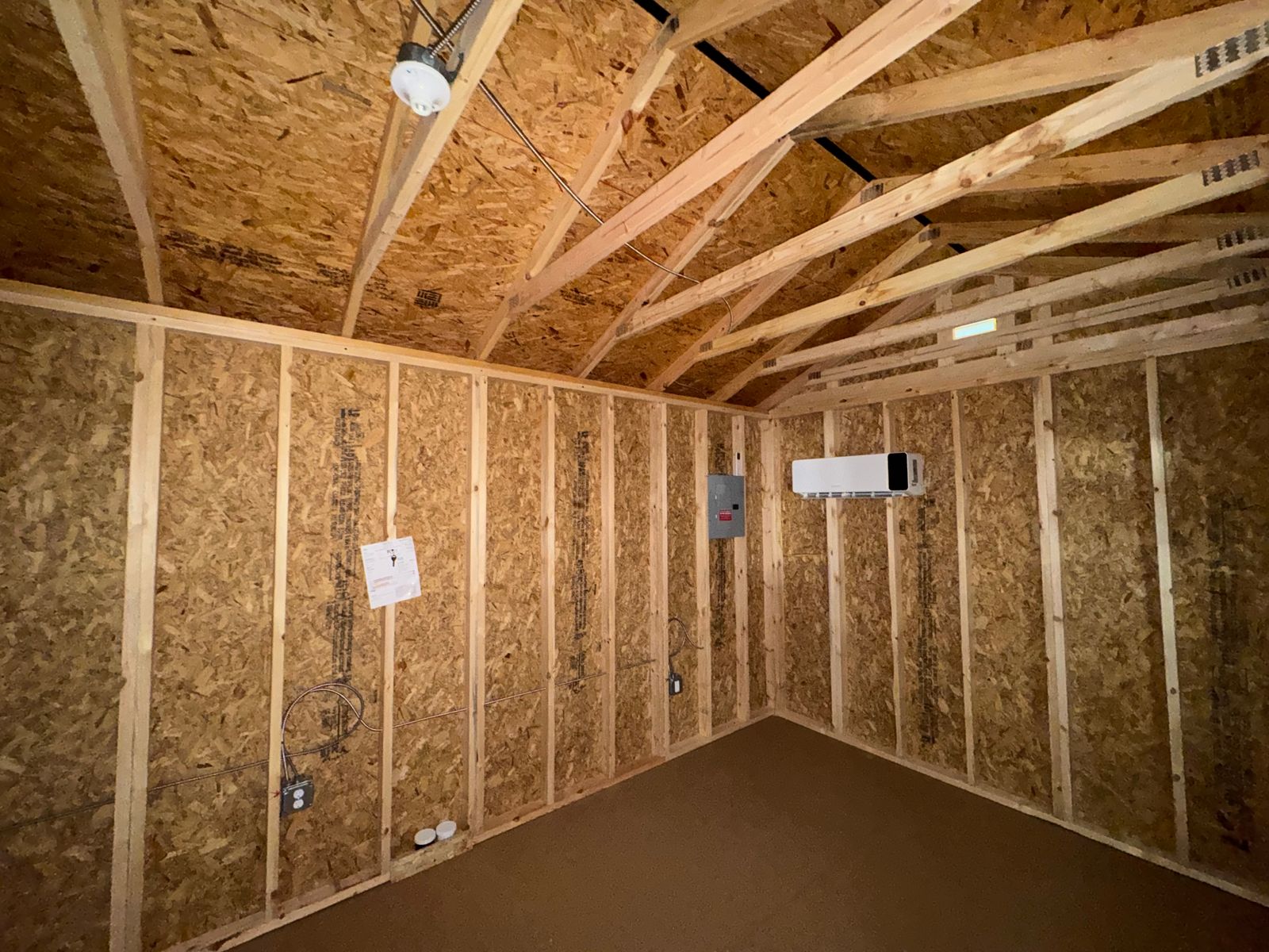 10x20 backyard office interior corner with electrical panel, outlets and mini-split