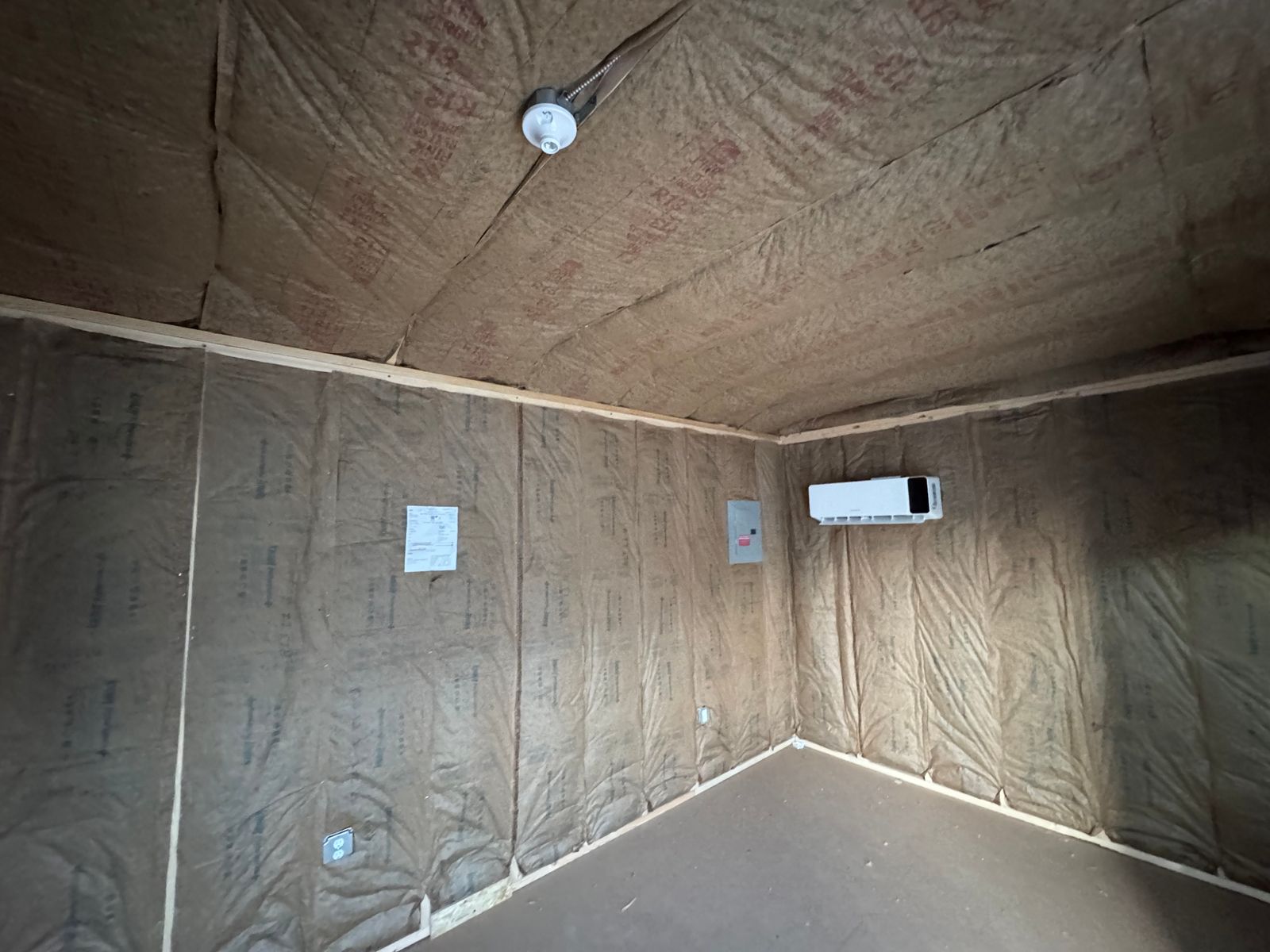 10x20 backyard office interior corner with mini-split unit and outlets
