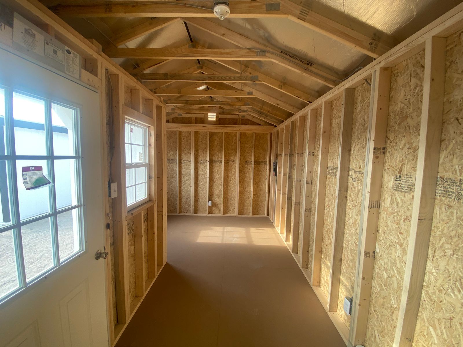 12x24 white Stor-Mor Center Cabin interior looking down the length from the door