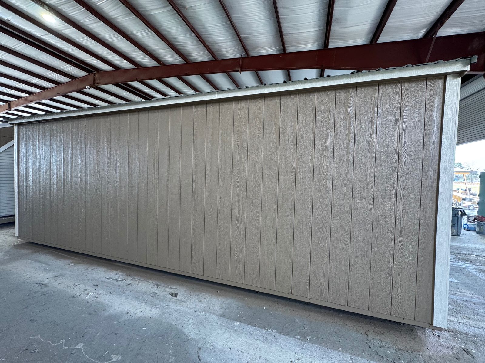 12x24 Stor-Mor garage in Buckskin, plain long side wall with Navajo White trim