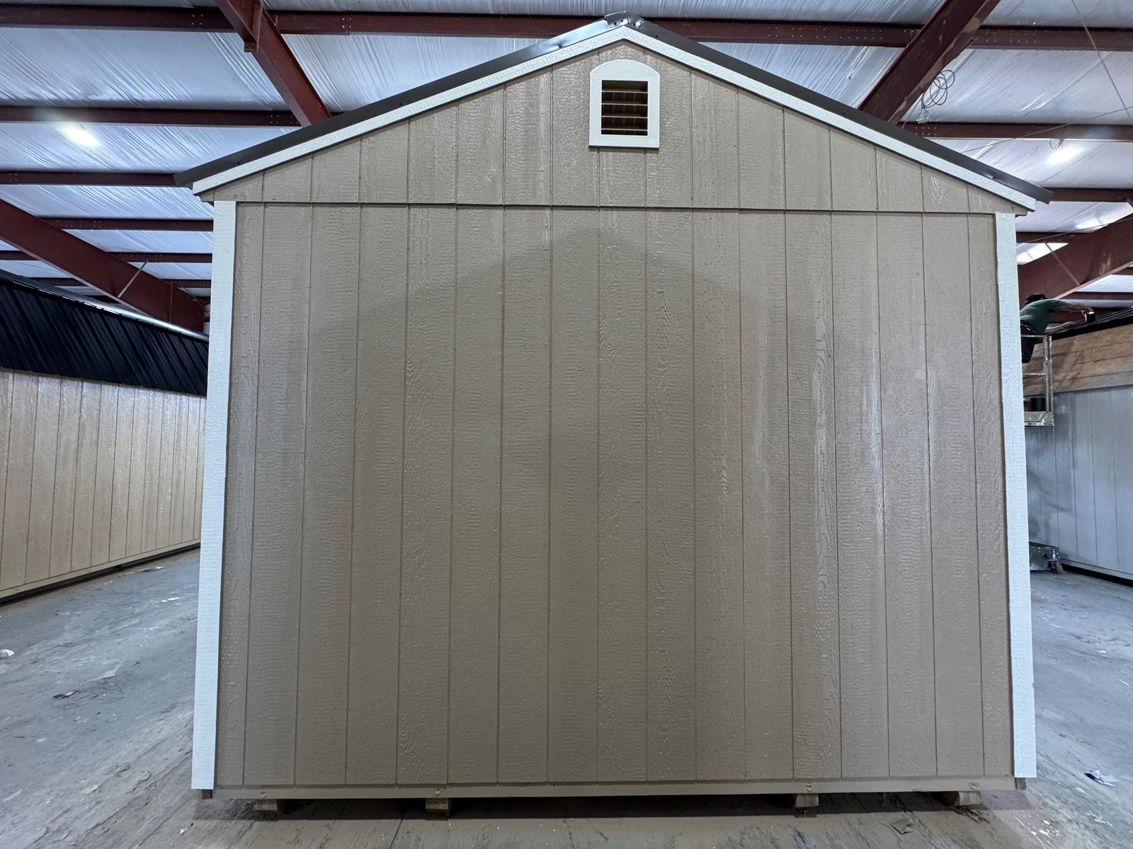 12x24 Buckskin Stor-Mor garage, rear gable end with vent and Navajo White corner trim