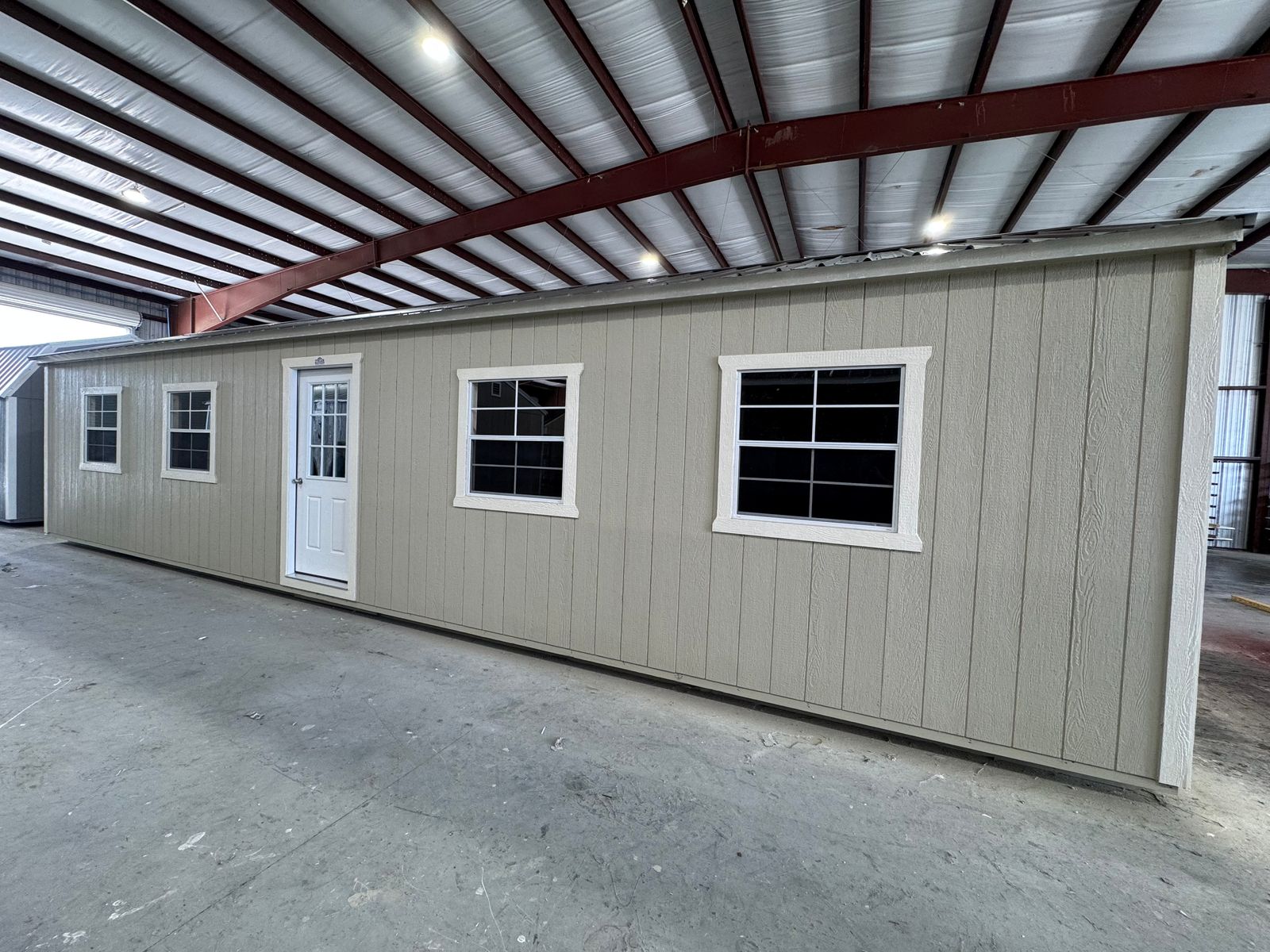 12x40 Stor-Mor Side Utility building in New Holland Beige with Navajo White trim, a 9-lite door, windows and a Burnished Slate roof