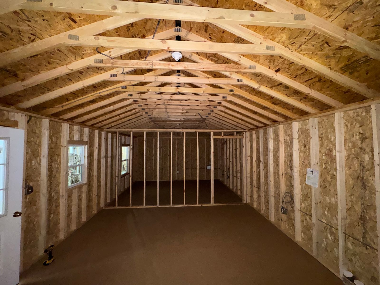 16x44 Stor-Mor Side Utility workshop interior looking toward the framed interior wall