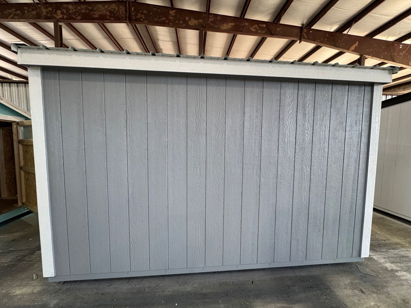 8x12 Stor-Mor Cottage Shed in Cape Cod Gray, rear wall with white trim and black roof edge