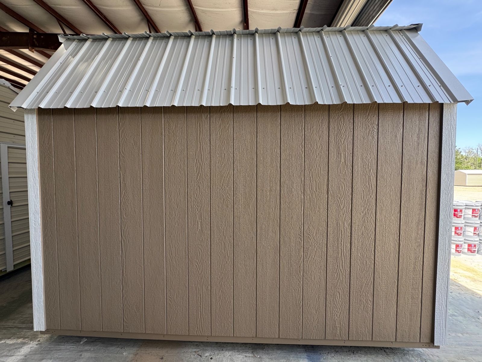 8x12 Stor-Mor Lofted Barn in Buckskin, long side wall under the white gambrel roof