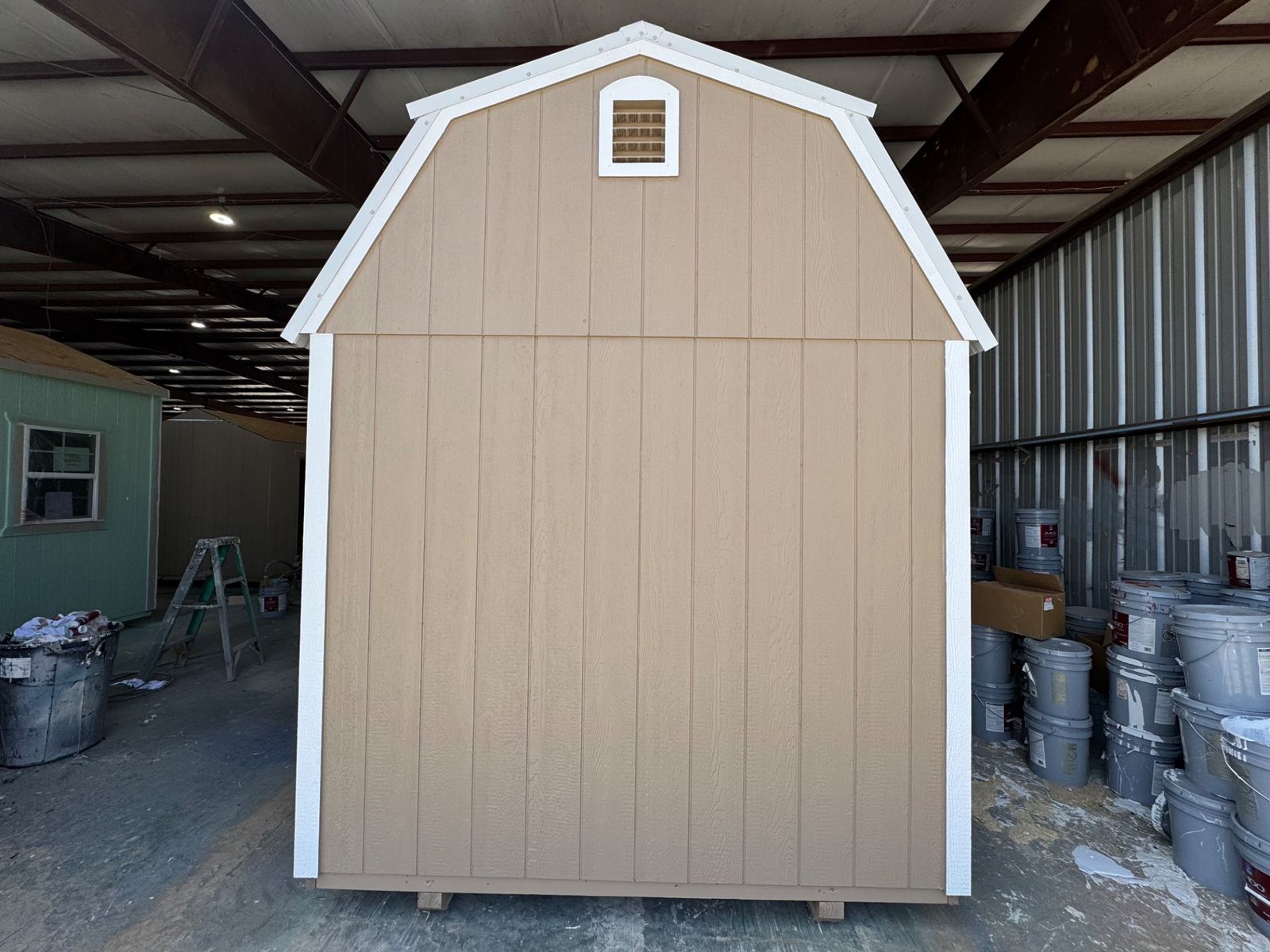 8x12 Stor-Mor Lofted Barn in Buckskin, rear gable end with vent and white trim