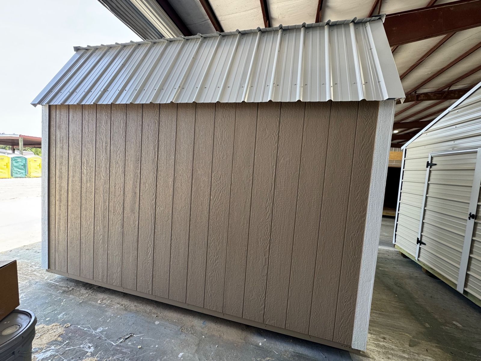 8x12 Stor-Mor Lofted Barn in Buckskin, opposite long side wall with white trim