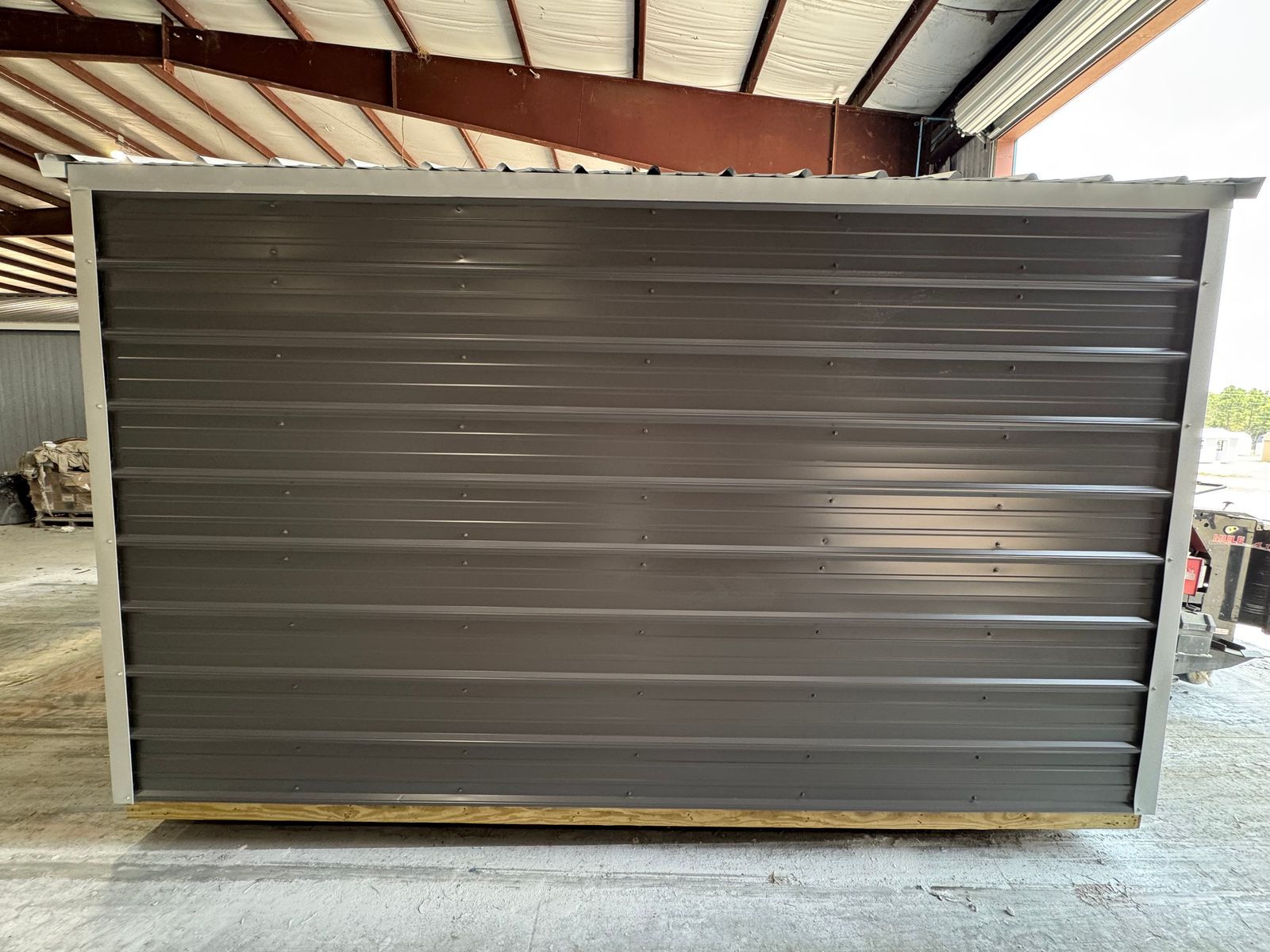 8x12 Stor-Mor Metal Utility in charcoal, opposite long side wall with white trim