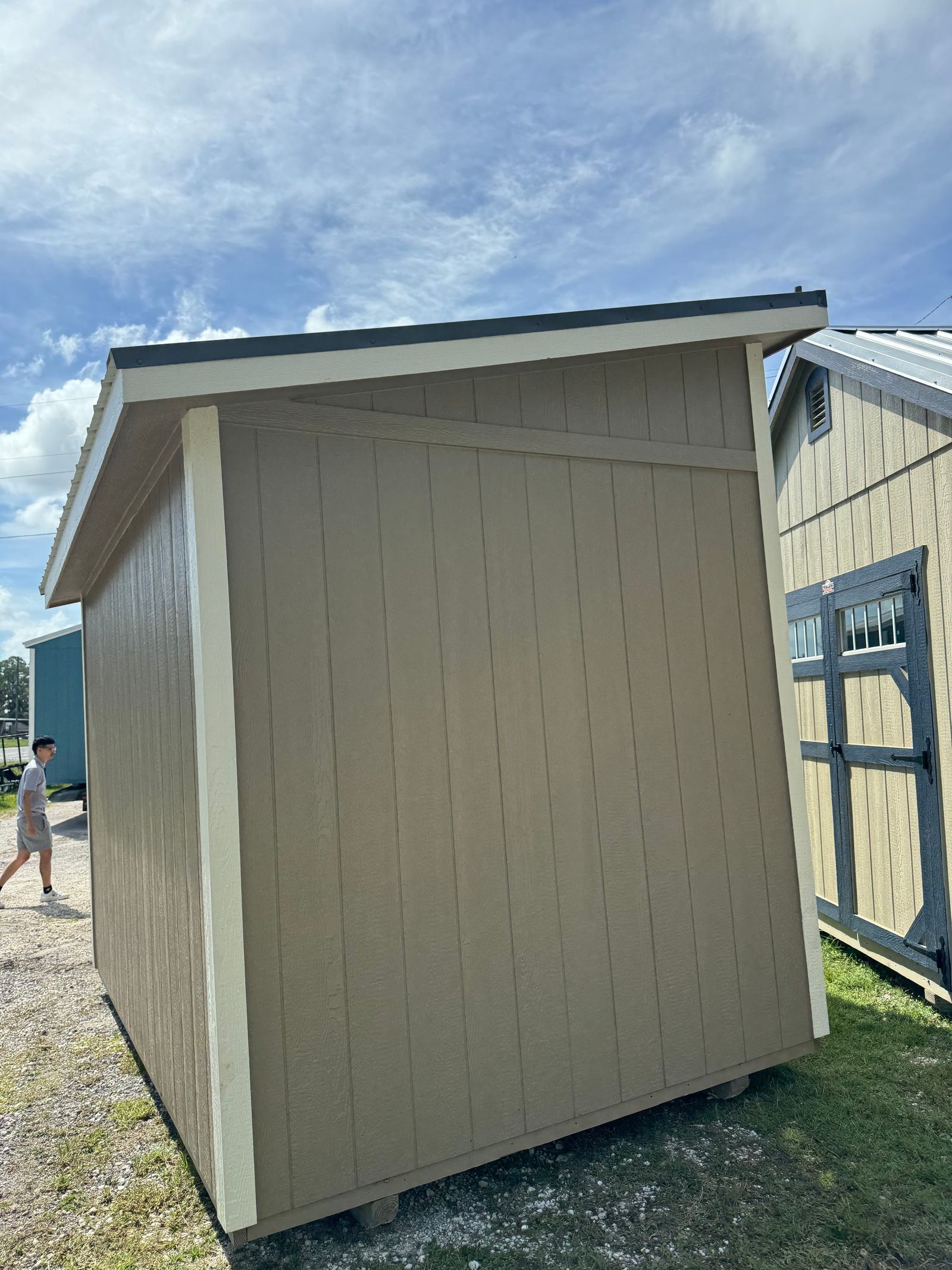 8x12 Buckskin Stor-Mor Studio rear corner view showing the side wall and single-slope roof