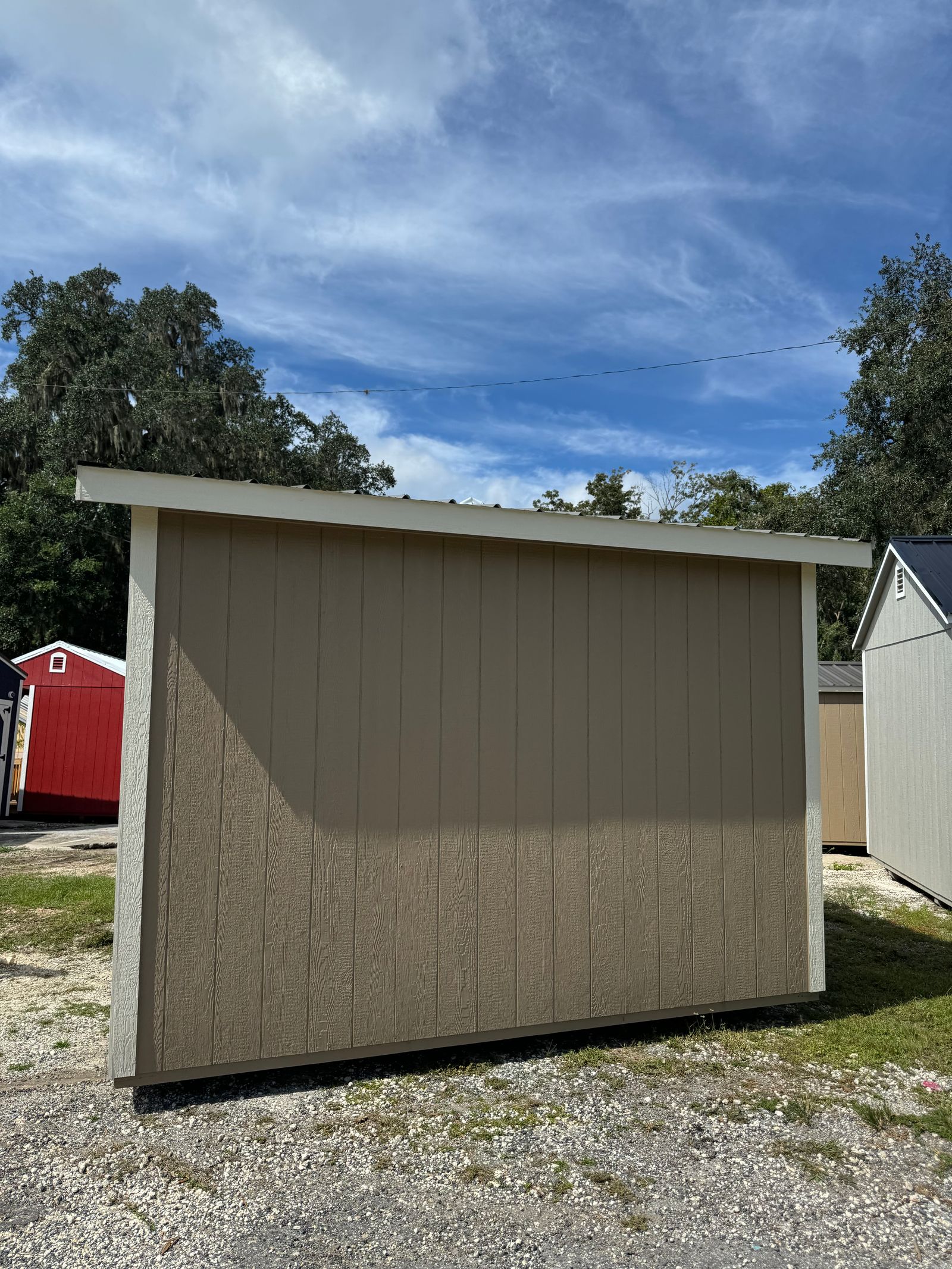Rear wall of the 8x12 Buckskin Studio with Navajo White corner trim