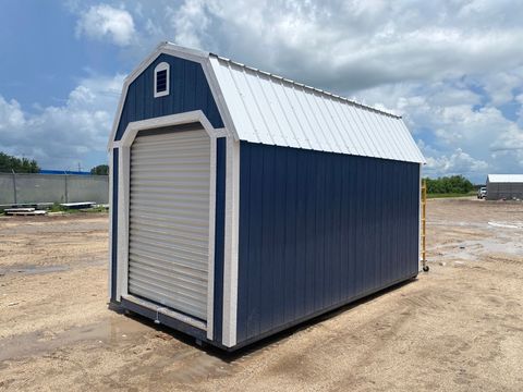 8x16 Stor-Mor Lofted Barn in Navy Blue with white trim, a roll-up door and a white gambrel roof