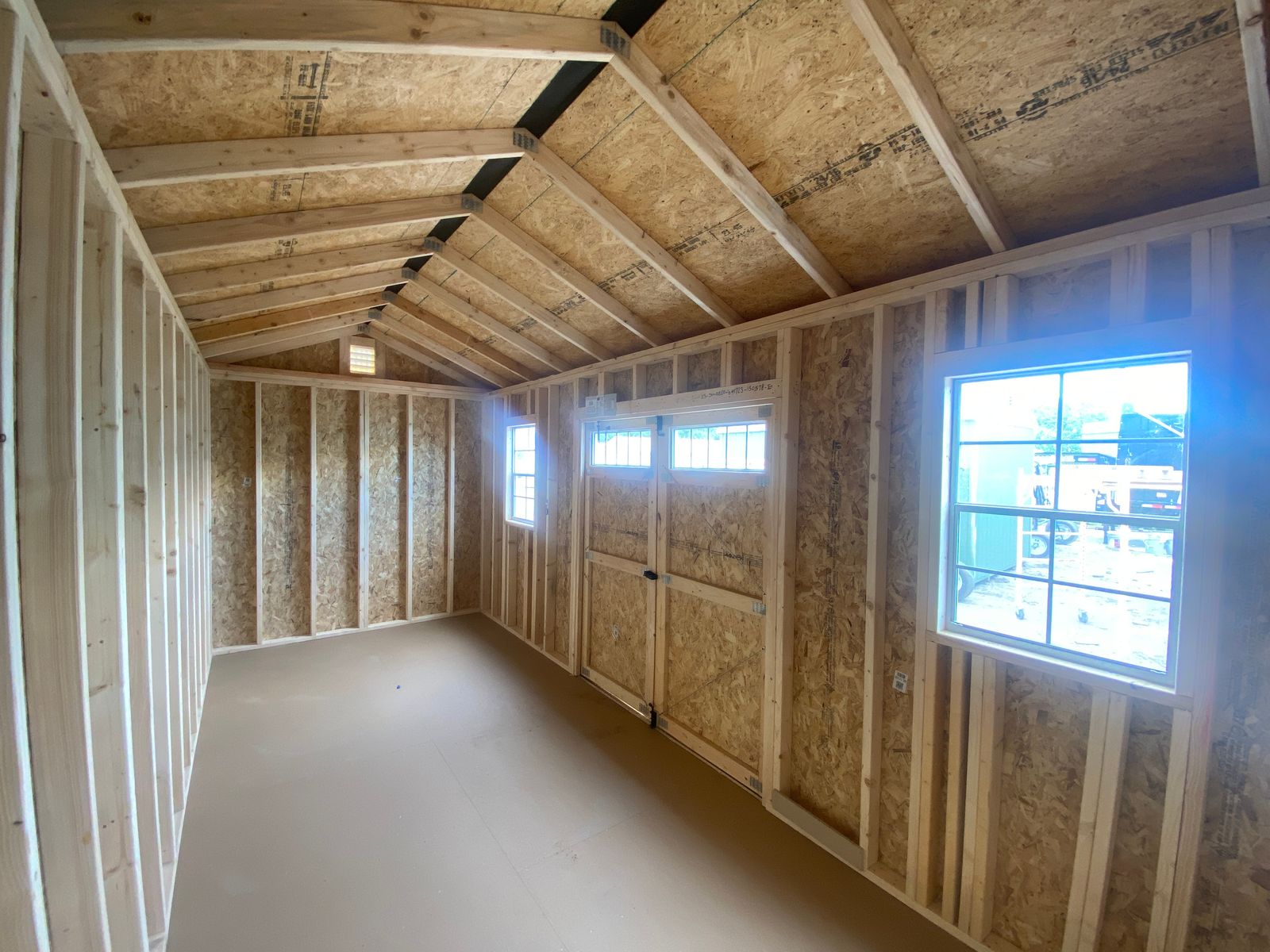 8x20 Stor-Mor Side Utility interior with window and transom doors, open rafters