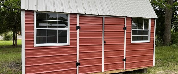 Metal Side Lofted Barn with gambrel roof and sidewall doors
